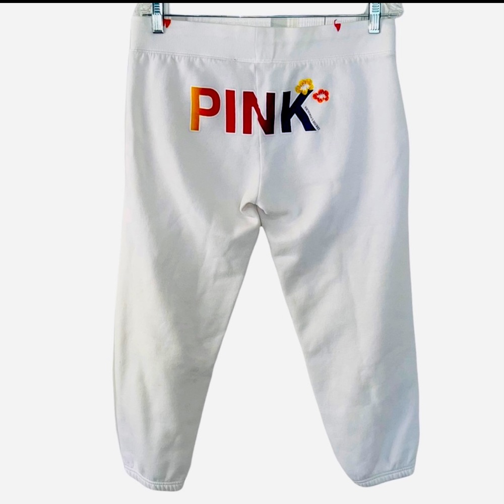 White joggers with VS Pink colored logo